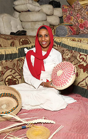 Basmala presenting her handmade products in her small business.