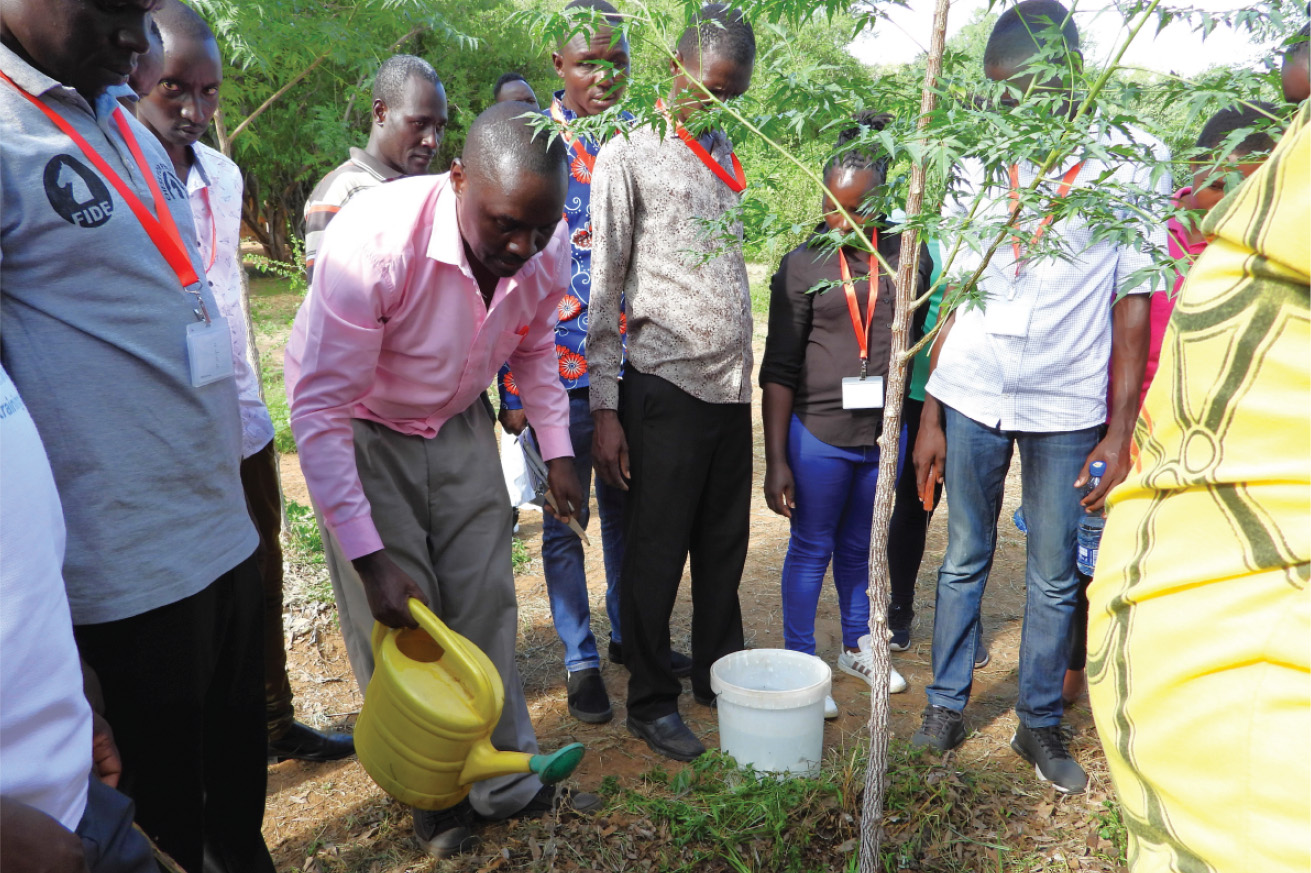 Students learning about planting trees, and organic farming/green agriculture.